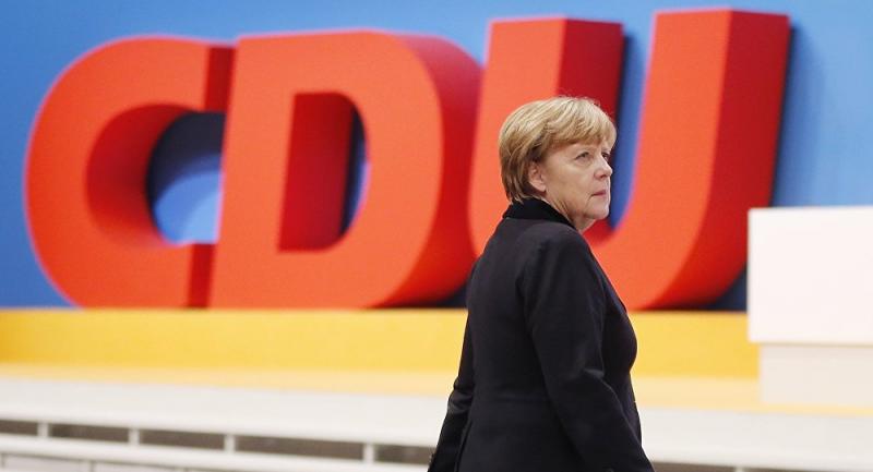 CDU Angele Merkel v Posarju krepko premagala SPD