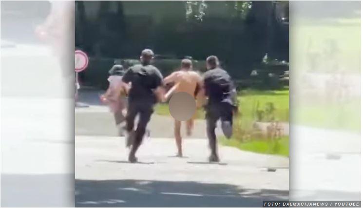 Nag skozi mesto: Nerealna scena - policija lovi golega moškega vpričo nune in mamice z otrokom