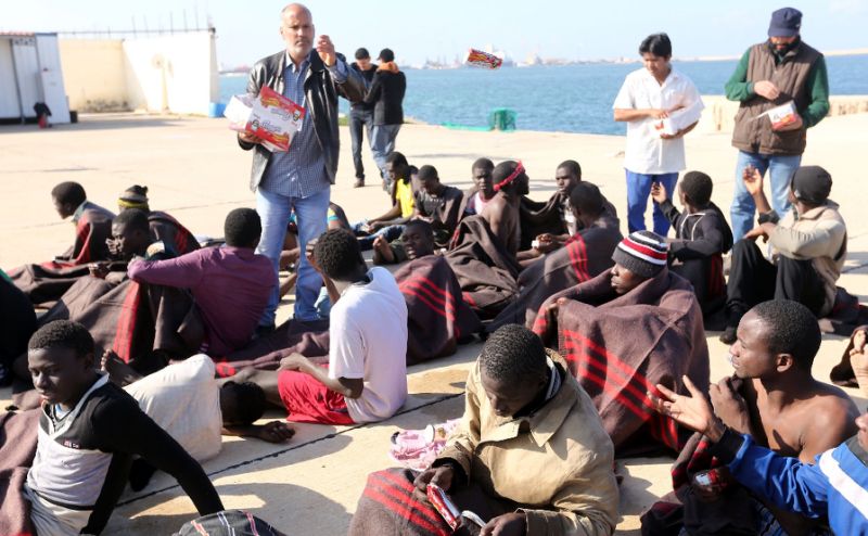 Migranti v Libiji, AFP Photo/Mahmud Turkia